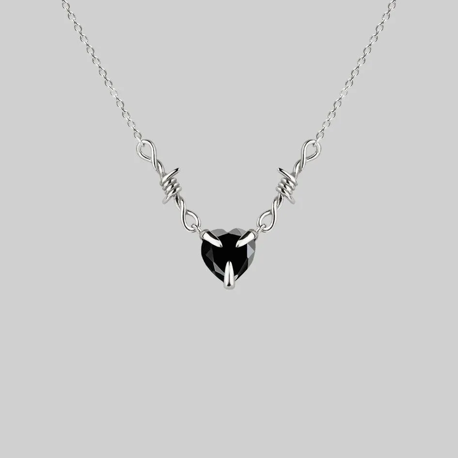 Sure! Heres an optimized product title: 

Elegant Silver Necklace with Barbed Wire and Black Onyx Heart Pendant