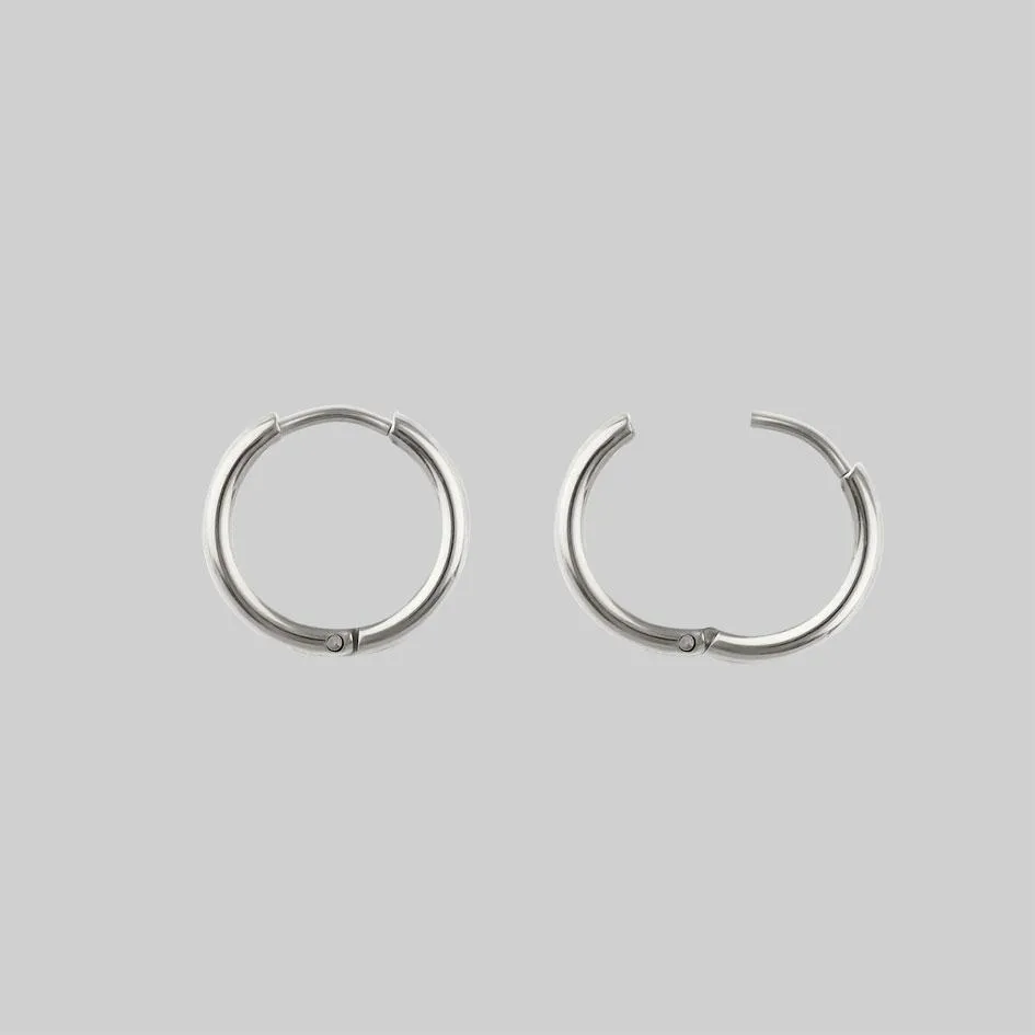 FORBIDDEN. Heart Dagger Hoop Earrings - Silver