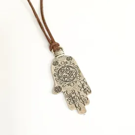 Necklace/mystical hand/leather and metal